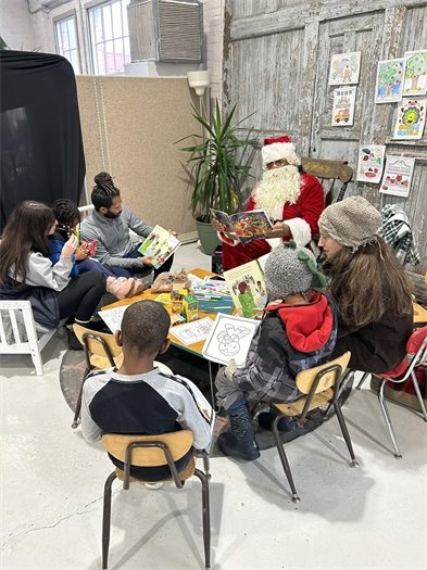 Community Reads hosted a special Read with Santa event during HoliFest at the Ypsilanti Farmers Marketplace.